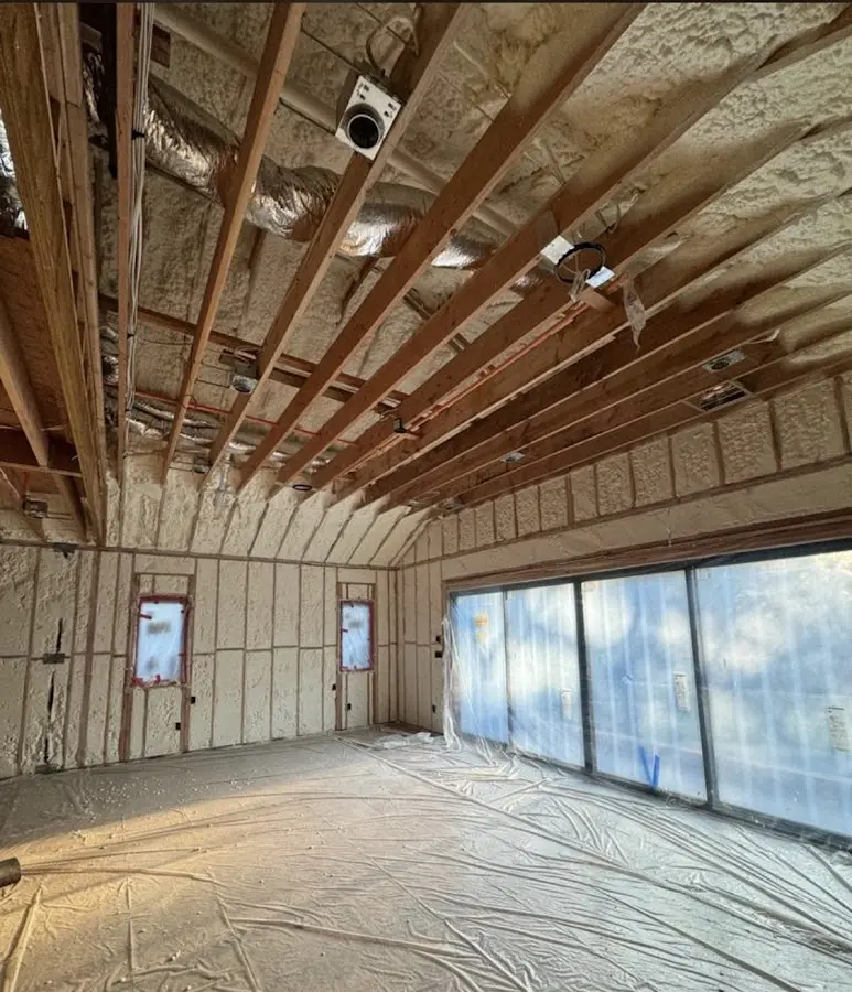 Interior walls and ceiling insulated with spray foam during new construction in Stratham